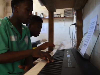 playing the keyboard in Room 8